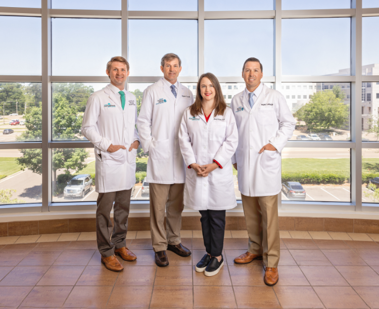 doctors standing in front of large window
